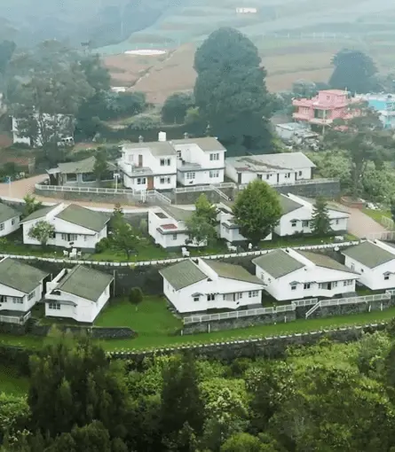 Aerial view of Greenwood Hill Cottage and its gardens among the Ooty hills